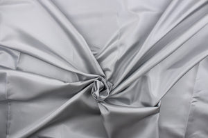 This taffeta fabric in solid silvery gray.