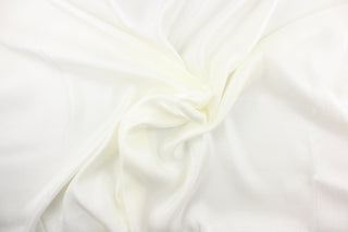 This bengaline faille fabric in a solid ivory white. This fabric has a slight shine and a slight ribs in the weft.