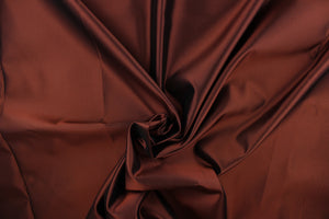 This taffeta fabric in iridescent in brown.