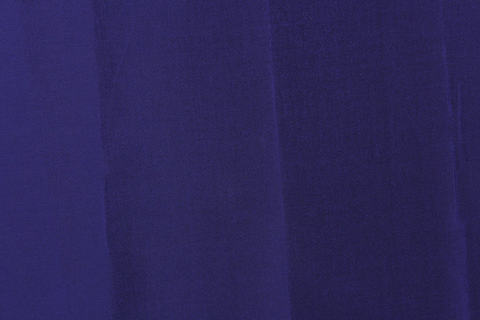 This taffeta fabric in iridescent in purple with undertones of black