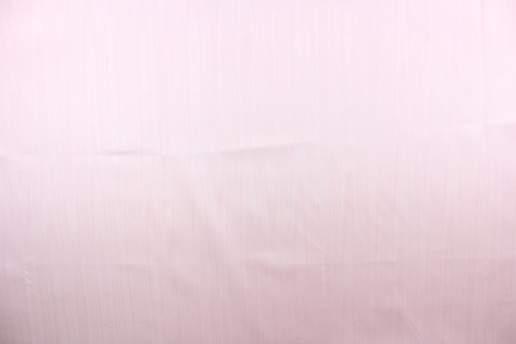 This taffeta fabric in a solid in soft pink. This fabric has a slight shine and a wavy, watery look.