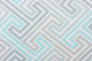 This fabric features a geometric design in gray, white and pale turquoise. 