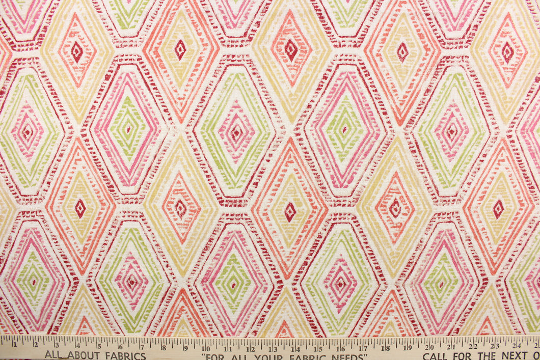 This fabric features a geometric design of diamonds in pink, yellow, coral, green, and red against a off white.