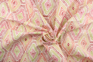 This fabric features a geometric design of diamonds in pink, yellow, coral, green, and red against a off white.