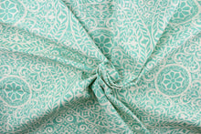 Load image into Gallery viewer, This fabric features a medallion design in turquoise and white. 
