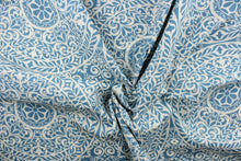 Load image into Gallery viewer, This fabric features a medallion design in blue and off white. 
