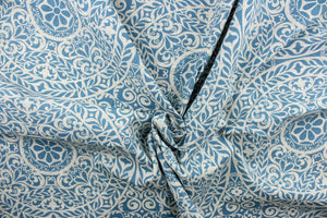 This fabric features a medallion design in blue and off white. 