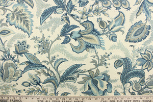 This fabric features a floral design in beige, blue, gray, and off white.