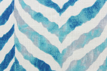 Load image into Gallery viewer, This fabric features a chevron zebra stripe design in turquoise, gray, white, and blue.
