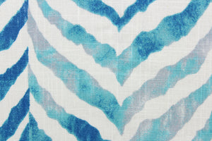 This fabric features a chevron zebra stripe design in turquoise, gray, white, and blue.