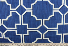 Load image into Gallery viewer, This fabric features a geometric design in white with black outline against a blue background.

