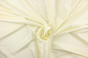 This taffeta fabric in a solid ivory. This fabric has a slight shine.  