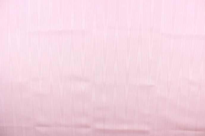 This taffeta fabric in a solid pink. This fabric has a slight shine and a wavy, watery look.  