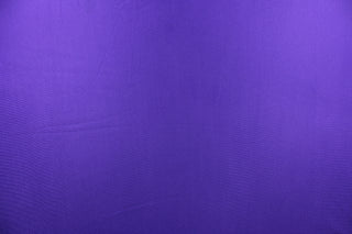 This fabric features a slight rib in a solid true purple.