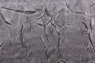 This taffeta fabric features a crinkle in iridescent silver gray.