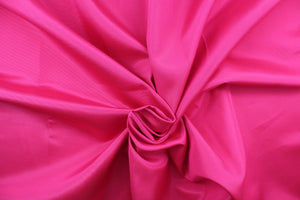 This bengaline faille fabric in a solid hot pink.  This fabric has a slight shine and a slight ribs in the weft. 