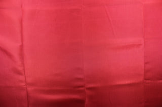 This bengaline faille fabric in a solid dark red.  This fabric has a slight shine and a slight ribs in the weft. 