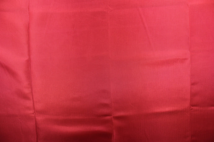 This bengaline faille fabric in a solid dark red.  This fabric has a slight shine and a slight ribs in the weft. 