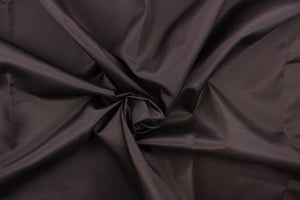 This bengaline faille fabric in a solid dark brown.  This fabric has a slight shine and a slight ribs in the weft. 