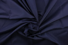Load image into Gallery viewer, This bengaline faille fabric in a solid dark navy almost black. This fabric has a slight shine and a slight ribs in the weft.
