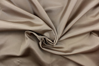 This bengaline faille fabric in a solid tan. This fabric has a slight shine and a slight ribs in the weft. 