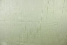 Load image into Gallery viewer, This taffeta fabric features a crinkle in iridescent pale green. 
