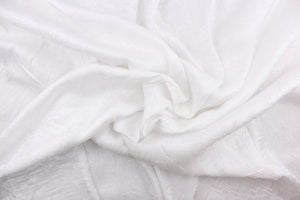 This taffeta fabric features a crinkle in iridescent bright white. 
