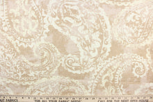 Load image into Gallery viewer,  This fabric features a paisley design in beige and white.
