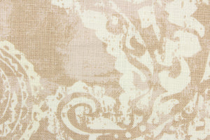  This fabric features a paisley design in beige and white.