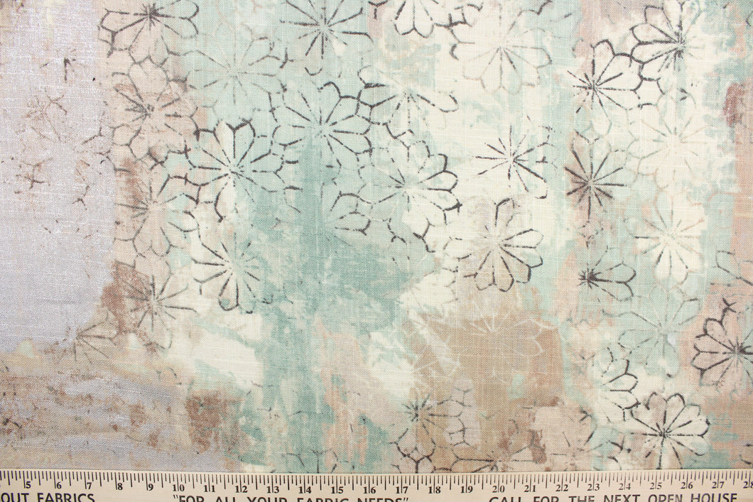 This fabric features a floral design in black, beige, brown, off white, seafoam green, and gray with hints of silver.