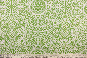 This fabric features medallion design in green and natural.