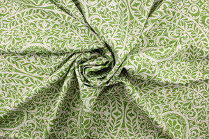 This fabric features medallion design in green and natural.