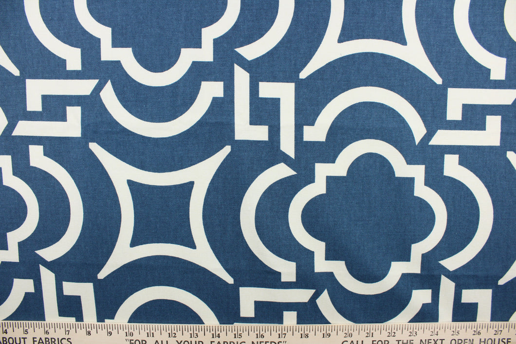  This fabric features a geometric design in blue and white .