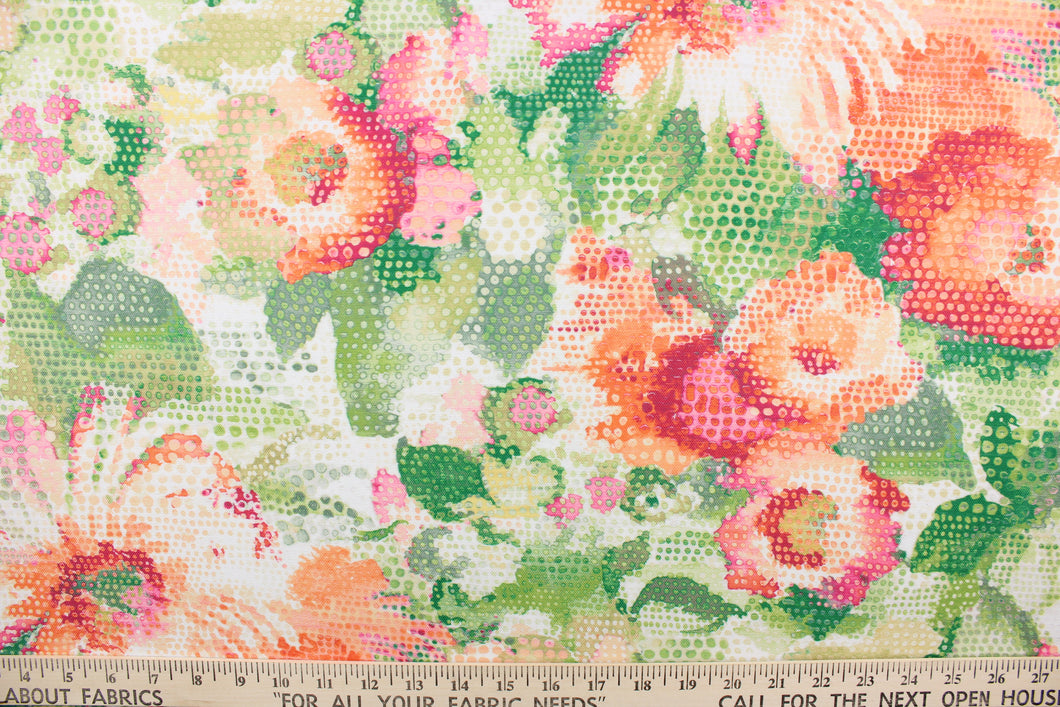 This fabric features a floral design in bright orange, pink, peach, green, hot pink, lime green, and white. 