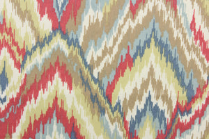 This fabric features a chevron design in blue, off white, beige, pale lime green, and dark pink. 