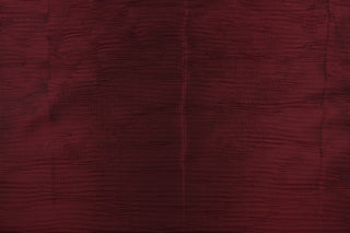 This taffeta fabric features a crinkle design in deep brunt red color.