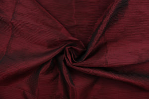 This taffeta fabric features a crinkle design in deep brunt red color.