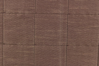  This beautiful jacquard fabric features an pin tuck block design in a taupe brown color