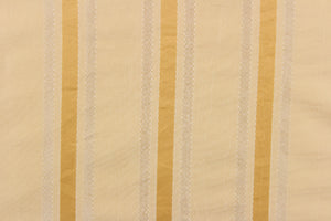 This stunning yarn dyed fabric features a striped pattern in light beige, with gold and champagne stripes . 