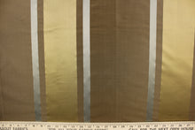 Load image into Gallery viewer, This stunning yarn dyed fabric features a striped pattern in brown, gray and gold. Enhancing the various colors of the stripes is a slight sheen.
