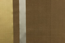 Load image into Gallery viewer, This stunning yarn dyed fabric features a striped pattern in brown, gray and gold. Enhancing the various colors of the stripes is a slight sheen.
