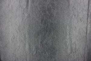  This taffeta fabric features a crinkle design in a rich silver gray.