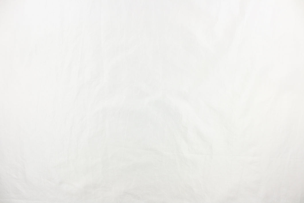 This taffeta fabric features a crinkle design in bright white.