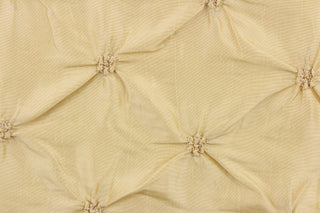 This beautiful jacquard fabric features an embroider gathered design in a golden khaki color.