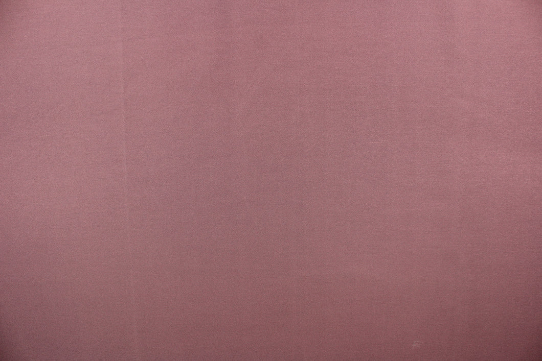 This beautiful versatile fabric offers a slight sheen in a solid moderate purple.