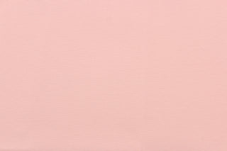 This beautiful versatile fabric offers a slight sheen in a solid bashful pink .