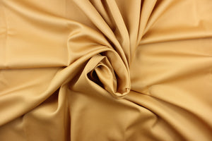 This beautiful versatile fabric offers a slight sheen in a solid true gold.