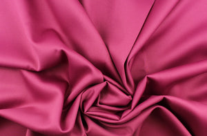 This beautiful versatile fabric offers a slight sheen in a solid rich deep pink. 