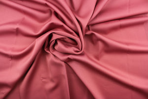 This beautiful versatile fabric offers a slight sheen in a solid mauve color.