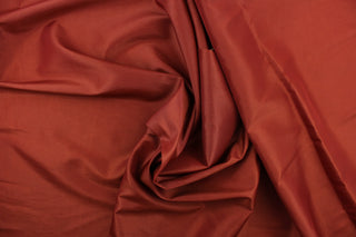This taffeta fabric in a solid rich reddish brown.